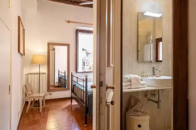 a bathroom with a sink and a mirror at Trastevering in Rome in Rome