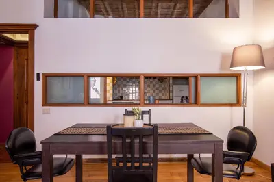a dining room with a table and chairs at Trastevering in Rome in Rome