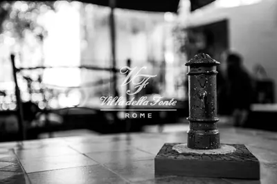 a black and white photo of a small pole on the floor at Villa della Fonte in Rome