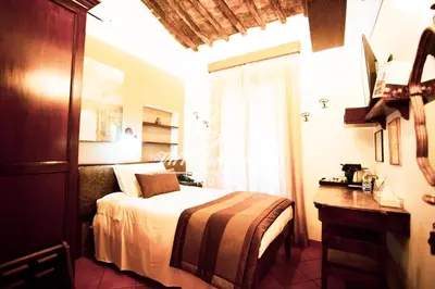 a hotel room with a bed and a window at Villa della Fonte in Rome