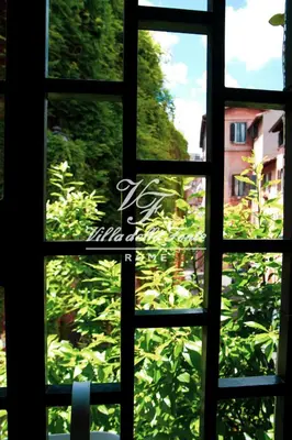 a view from a window looking out at a garden at Villa della Fonte in Rome