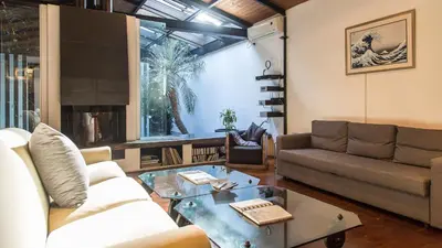 a living room with a couch and a coffee table at Rental in Rome Riari Garden in Rome