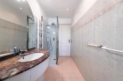 a bathroom with a sink and a shower at Casa Emme in Rome