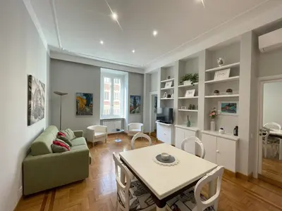 a living room with a couch and a table at Maresi Suite in Rome