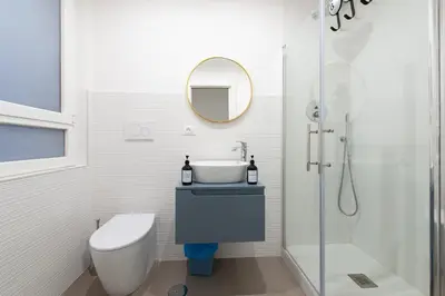 a bathroom with a sink and a toilet and a mirror at St Peter Boutique 1 in Rome
