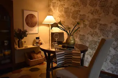 a room with a table with a vase on it at BOUTIQUE TRASTEVERE in Rome