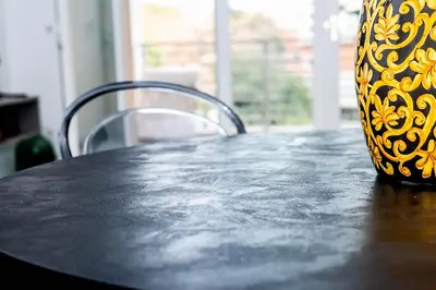 a black and yellow vase sitting on a table at Sant'Agata in Trastevere in Rome