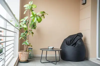 a black bean bag chair sitting next to a table at Sant'Agata in Trastevere in Rome