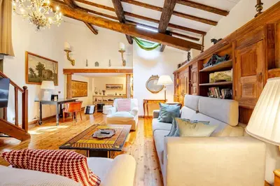 a living room with a couch and a table at Rome's Hidden Gem in Rome