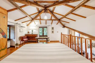 a large room with a ceiling with wooden beams at Rome's Hidden Gem in Rome