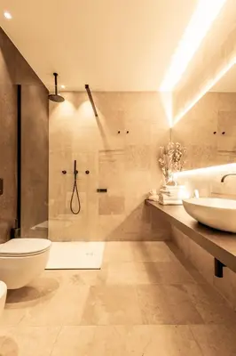 a bathroom with two sinks and a shower at Ædrian's Loft. Boutique apartment with private terrace in the center of Rome in Rome