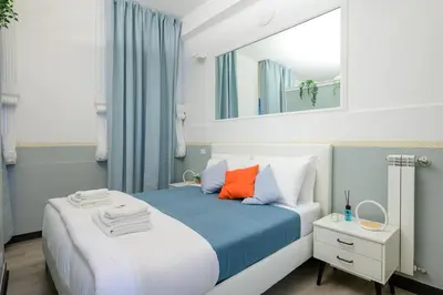 a bedroom with a bed with a mirror on it at Appartamento via di Torre Argentina (Navona) in Rome