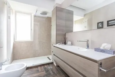 a bathroom with a sink and a toilet and a tub at Gregory 7House Vaticano in Rome