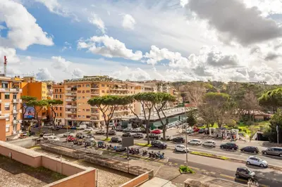 a view of a city street with cars and buildings at Gregory 7House Vaticano in Rome
