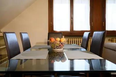 a dining room table with a bowl of oranges on it at Casa Justa Anastasio in Rome