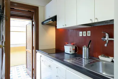 a kitchen with a sink and a counter top at Casa Justa Anastasio in Rome