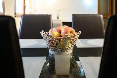 a bowl of apples sitting on top of a table at Casa Justa Anastasio in Rome