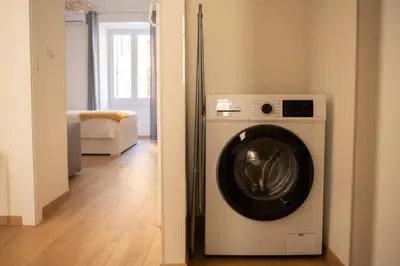 a washer and dryer sitting in a room at Casa M.O.R.E. in Rome