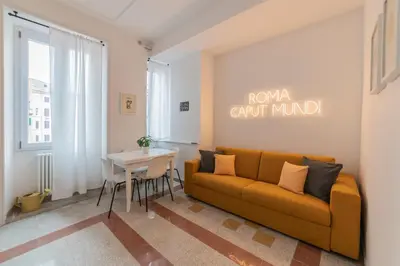 a living room with a couch and a table at Vintage Giuliana Apartment in Rome