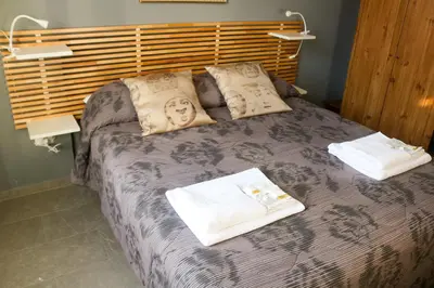 a bedroom with a bed with two towels on it at FLOWER HOUSE in Rome