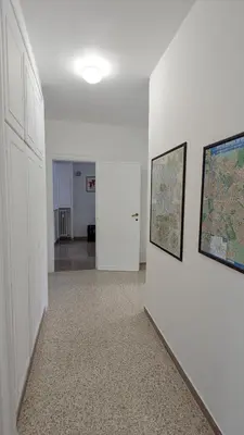 an empty hallway with a map on a wall at A casa nostra - Musei Vaticani in Rome