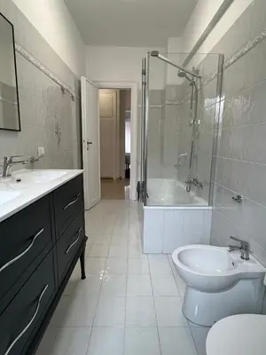 a bathroom with a sink and a toilet and a shower at A casa nostra - Musei Vaticani in Rome