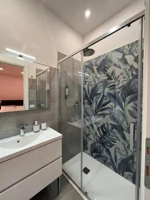 a bathroom with a shower and a sink at Colosseum Deluxe in Rome