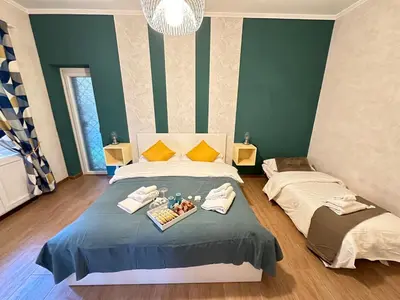 a bedroom with a bed with a tray of food on it at Il Giardino a Monte Sacro in Rome