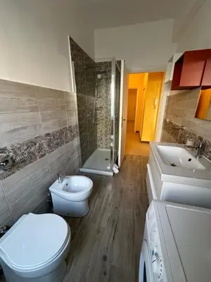 a bathroom with a toilet and a sink and a shower at Il Giardino a Monte Sacro in Rome