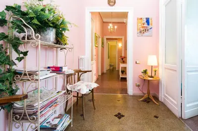 a hallway with a room with pink walls at Boezio House in Rome