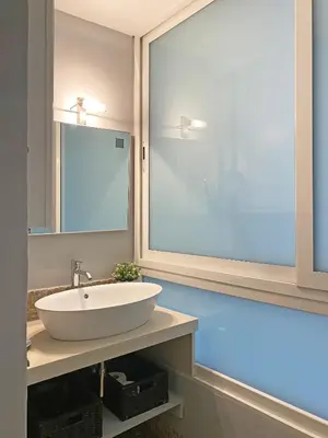 a bathroom with a white sink and a mirror at Via Giulia apartment / historic center of Rome in Rome
