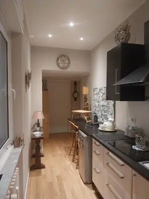 a kitchen with a counter top and a table at NINA'S HOUSE in Rome