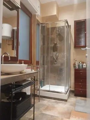 a bathroom with a shower and a sink at NINA'S HOUSE in Rome