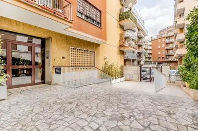 an empty patio in front of a building at Retro design flat near Vaticano in Rome