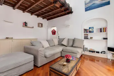 a living room with a couch and a coffee table at Che Eleganza! Irresistibile dimora, Campo de Fiori in Rome