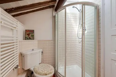 a bathroom with a toilet and a shower at Che Eleganza! Irresistibile dimora, Campo de Fiori in Rome