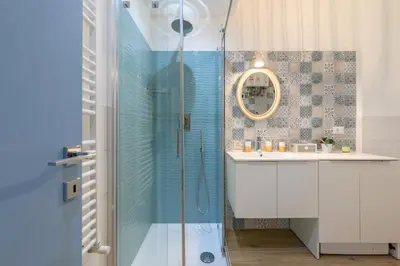 a shower with a glass door in a bathroom at Appartamento via Visconti in Rome