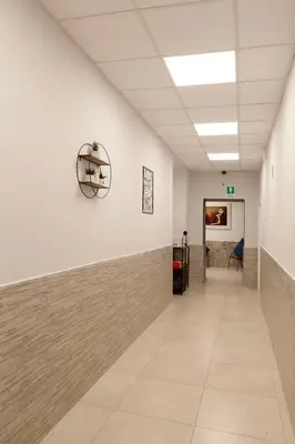 a hallway of an office building with a hallway at ANGI HOME in Rome