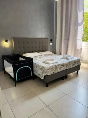 a bedroom with a large bed with a mattressvisor at ANGI HOME in Rome