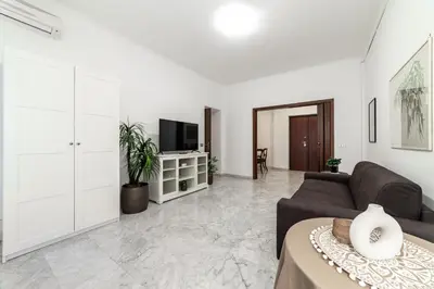 a living room with a couch and a tv at EV Vatican Apartment in Rome
