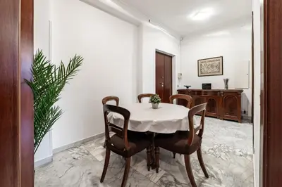a dining room with a table and chairs at EV Vatican Apartment in Rome