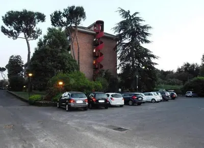 a group of cars parked in a parking lot at Edi's House in Rome