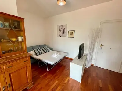 a living room with a couch and a tv at Edi's House in Rome