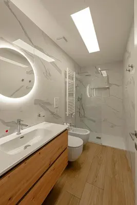 a white bathroom with a sink and a toilet at Dolce casa al Vaticano in Rome