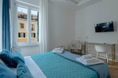 a bedroom with a bed and a window at Dolce casa al Vaticano in Rome