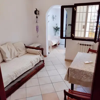 a living room with a couch and a table at Appartamento Eleonora in Rome