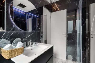 a bathroom with a sink and a mirror at Romantic Suite Colosseum - Luxury Apartment in Rome