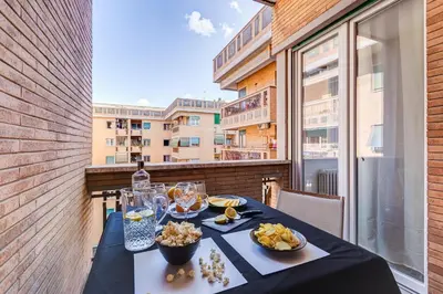 a table with food on top of a balcony at BDC - The Perfect Mix in Rome