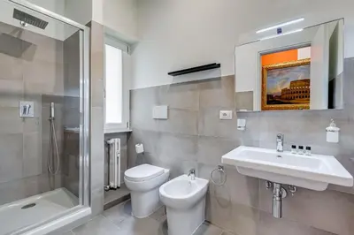 a bathroom with a toilet and a sink and a shower at BDC - The Perfect Mix in Rome