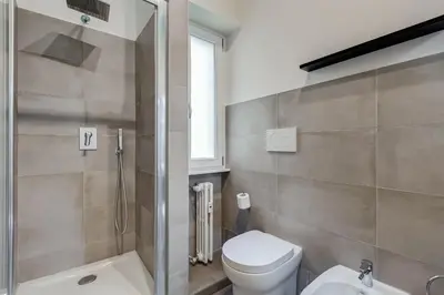 a bathroom with a toilet and a shower and a sink at BDC - The Perfect Mix in Rome